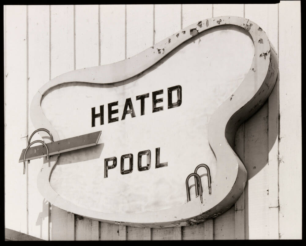 "Heated Pool" Sign at Motel. US 99, Bakersfield, California