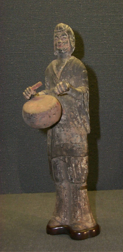 Figure Playing a Drum