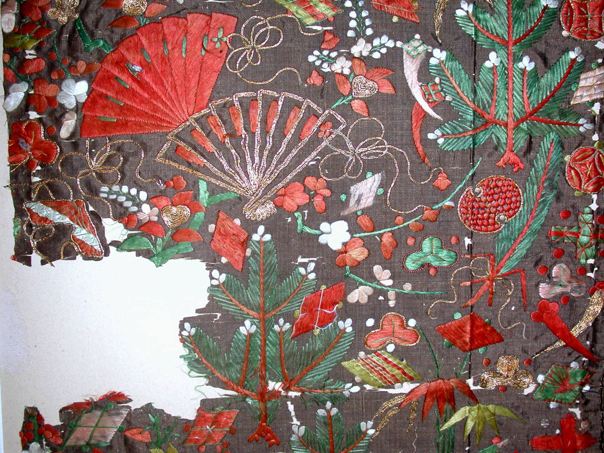 Fragment from koshimaki with pine, bamboo, plum, and treasure design