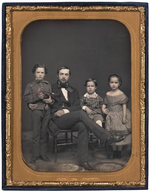 Family Group with Boy Holding Rooster
