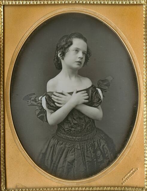 Young girl with arms crossed