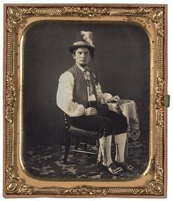 Man Wearing Plumed Hat and Ethnic Dress