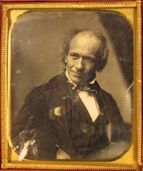 Thoughtful man, with head cocked