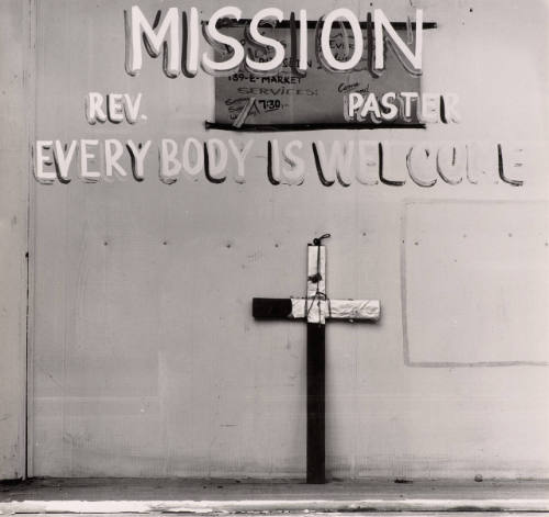 [Cross in window]