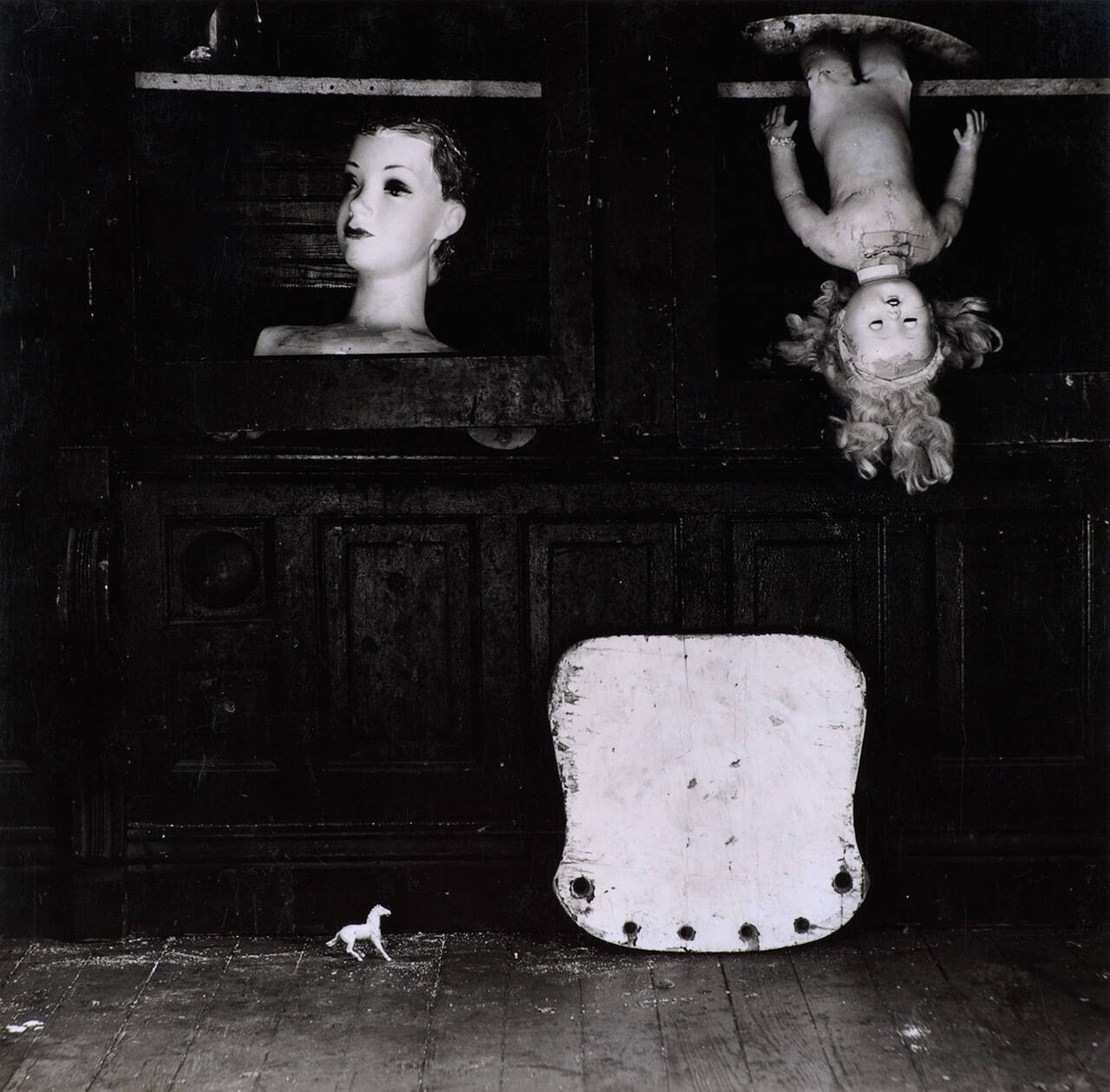 [Still life: dolls, seat, horse]
