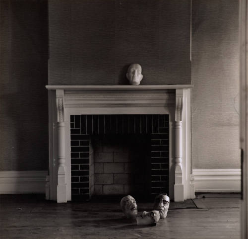 [Four masks in interior]