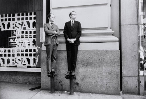 Two Men on Standpipes, Watching Parade