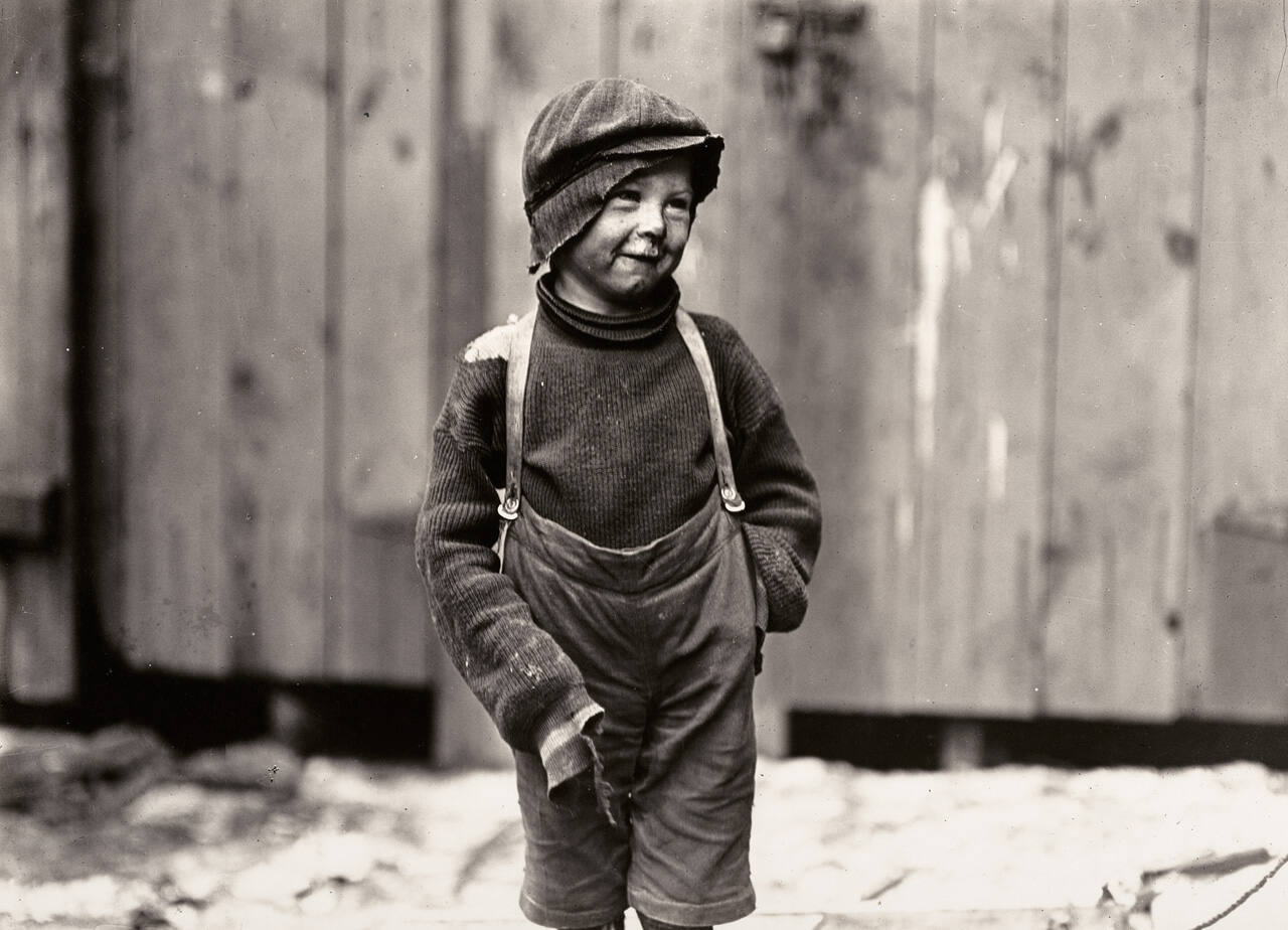 Untitled (child in tattered clothing)