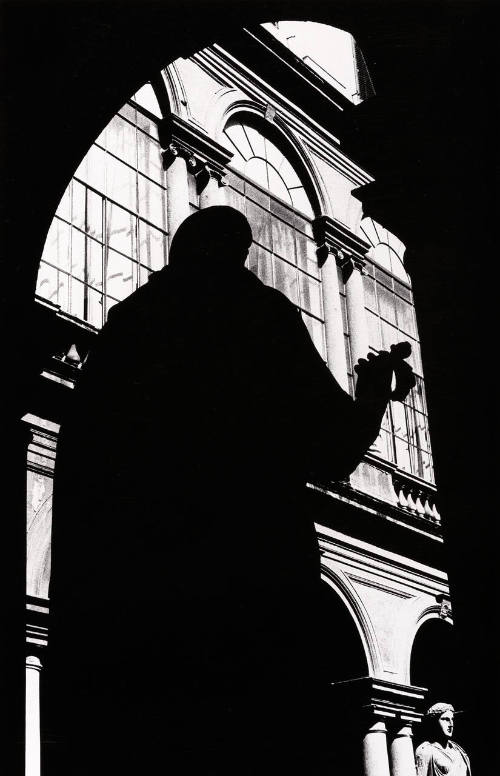 Statue Silhouetted in Court