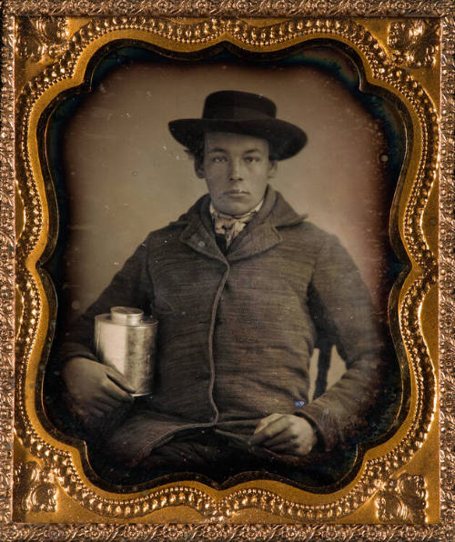Young Man with Metal Can
