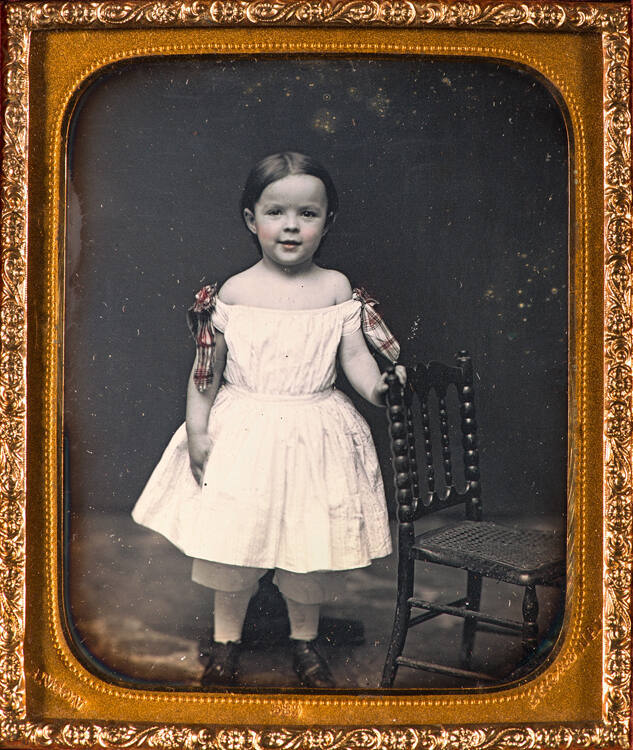 Standing girl in white dress