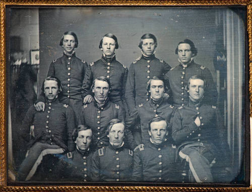 Uniformed officers in studio with photographer