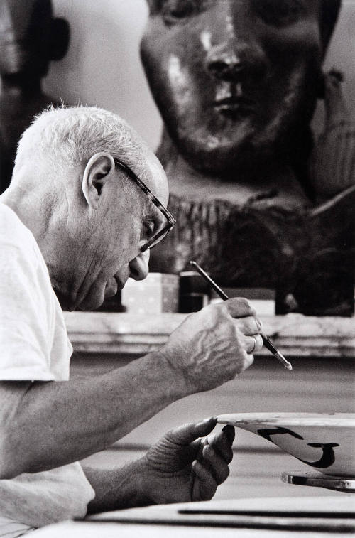 Picasso at work on another plate