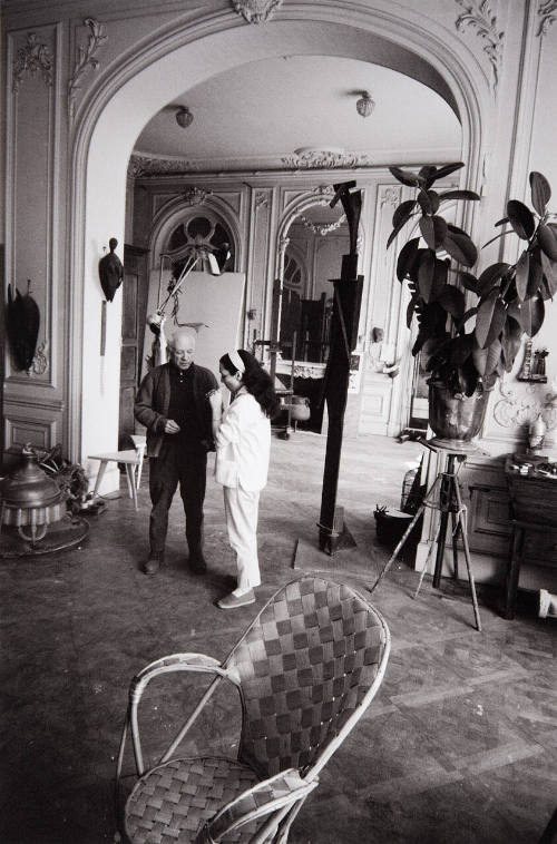 Picasso and Jacqueline standing in studio