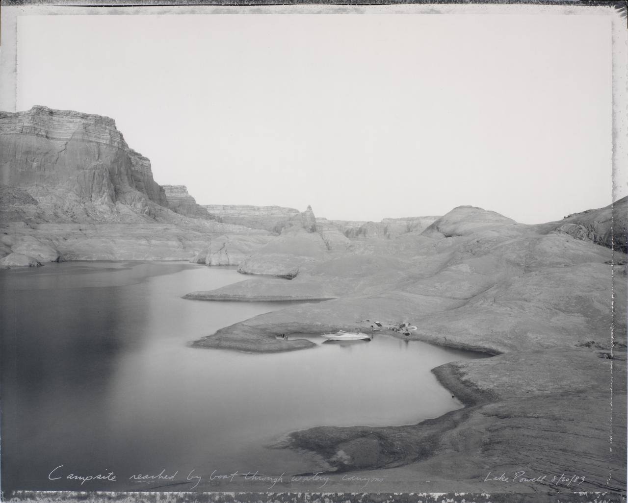 Campsite reached by boat through watery canyons, Lake Powell, 8/20/83
