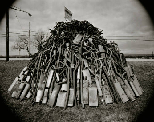 Pile of Mufflers at Muffler City. NY 5A, Utica, New York