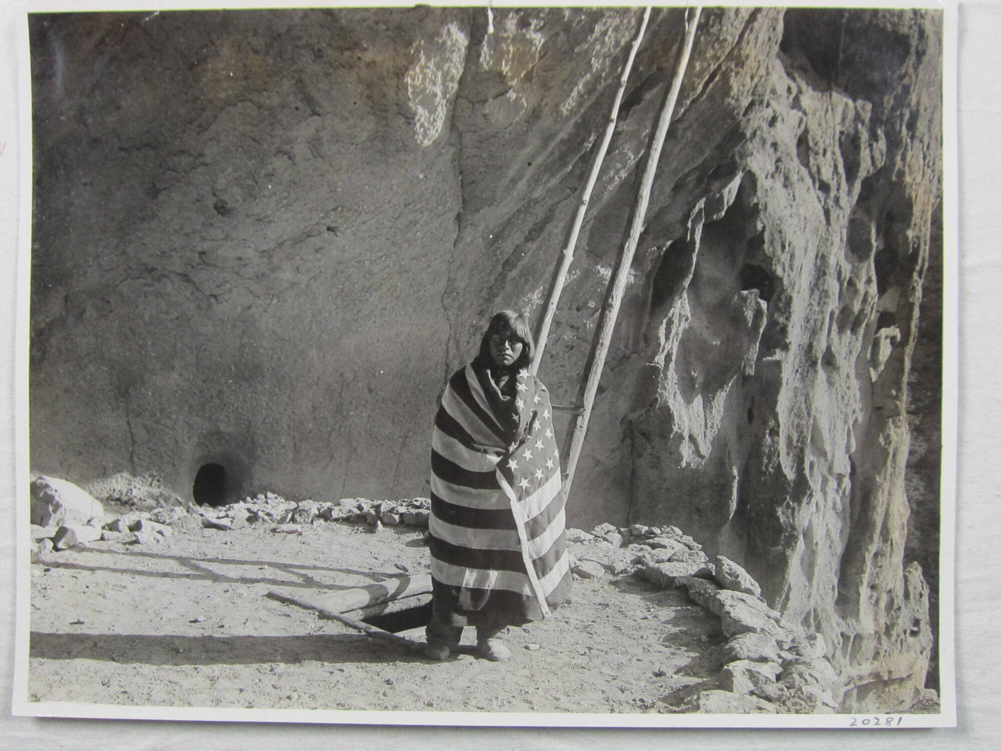 Pueblo Indian standing outside the underground kiva, New Mexico