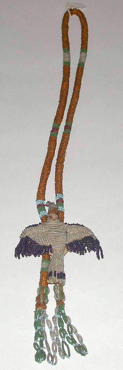 Beaded strand with attched beaded bird