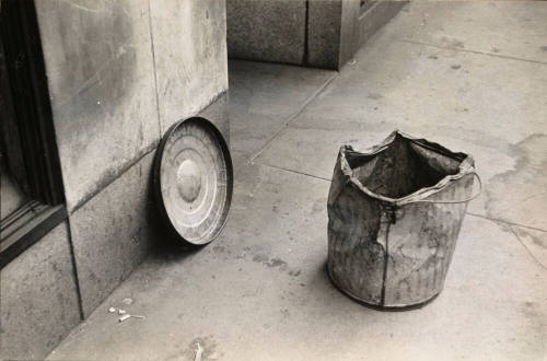 Battered trash can