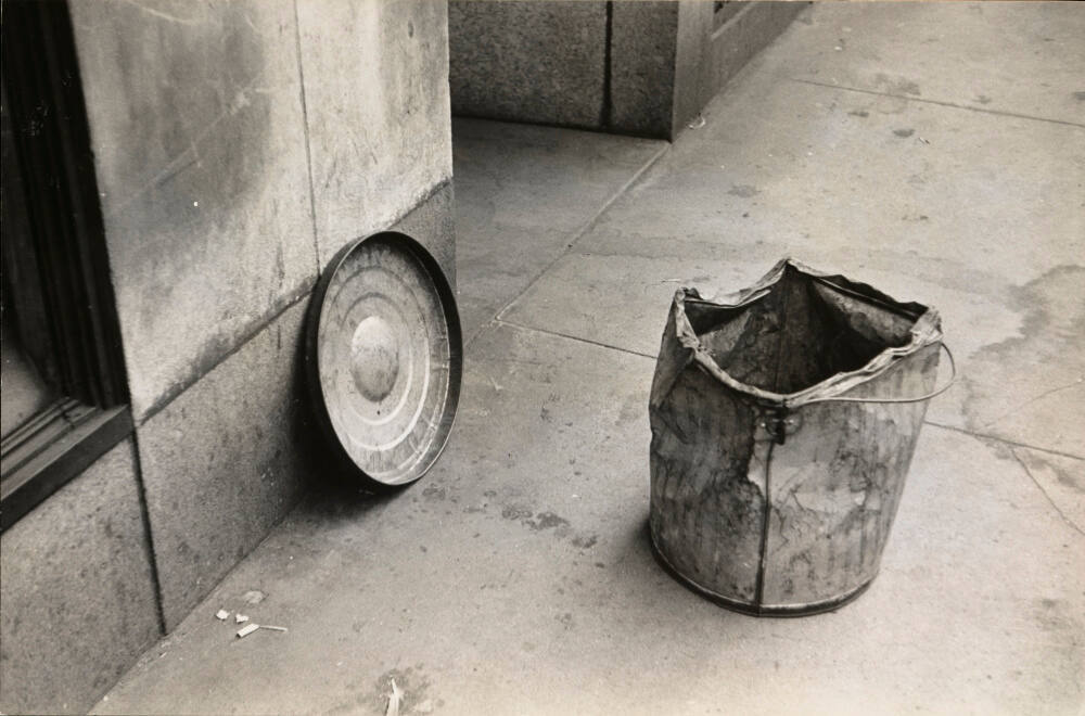 Battered trash can