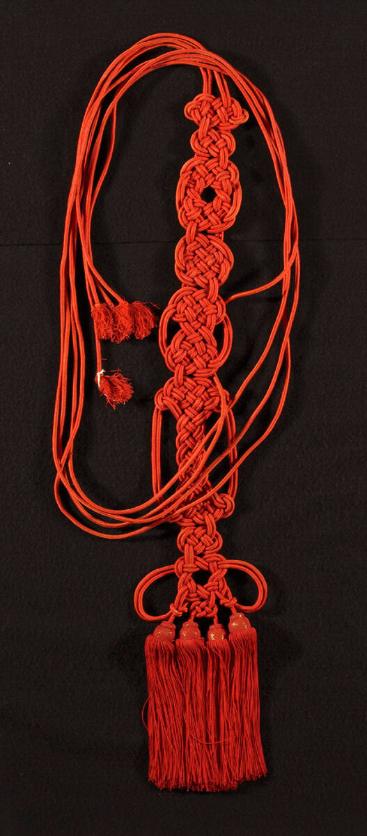 Buddhist monk's red tassels
