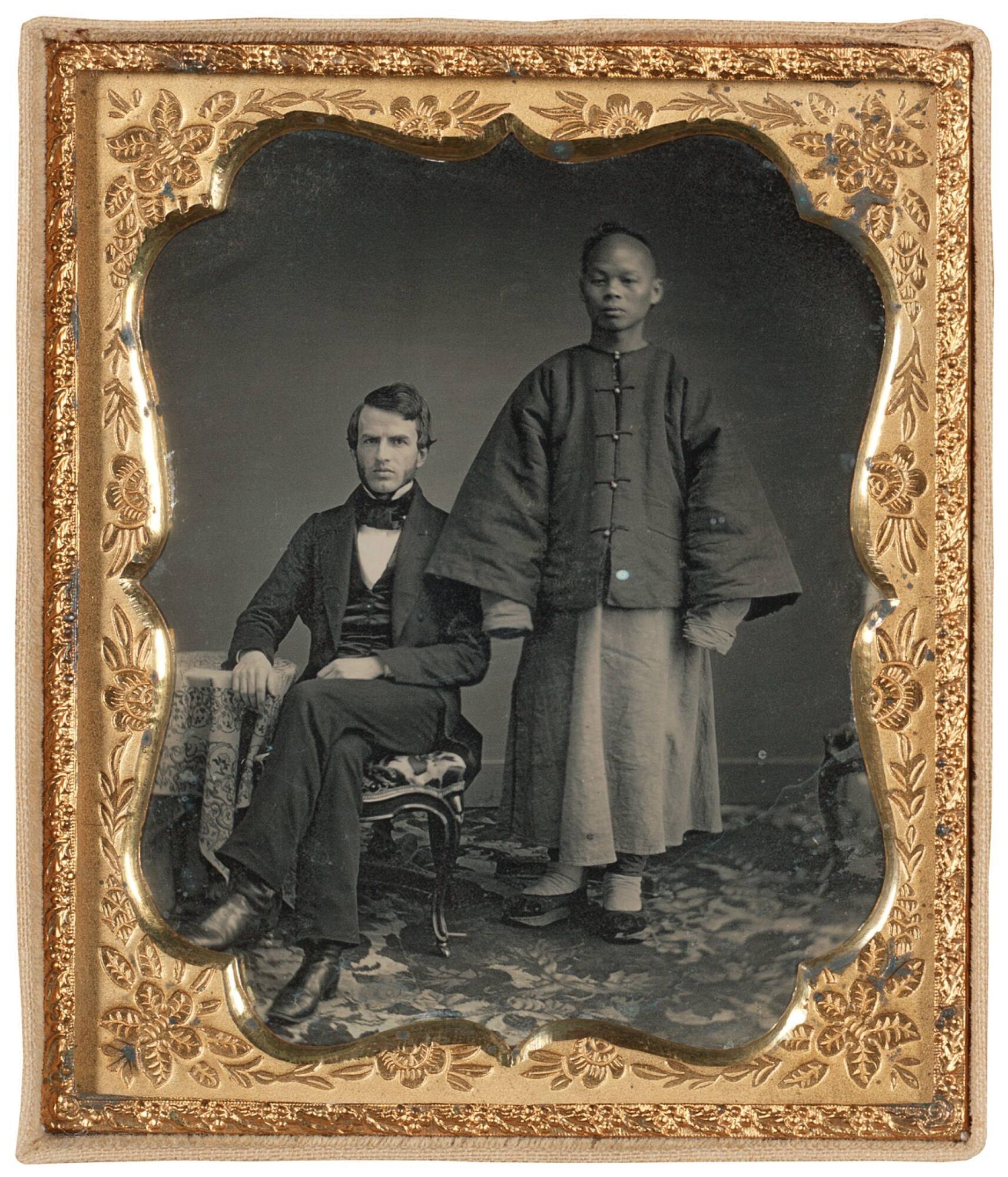 Portrait of a man and attendant