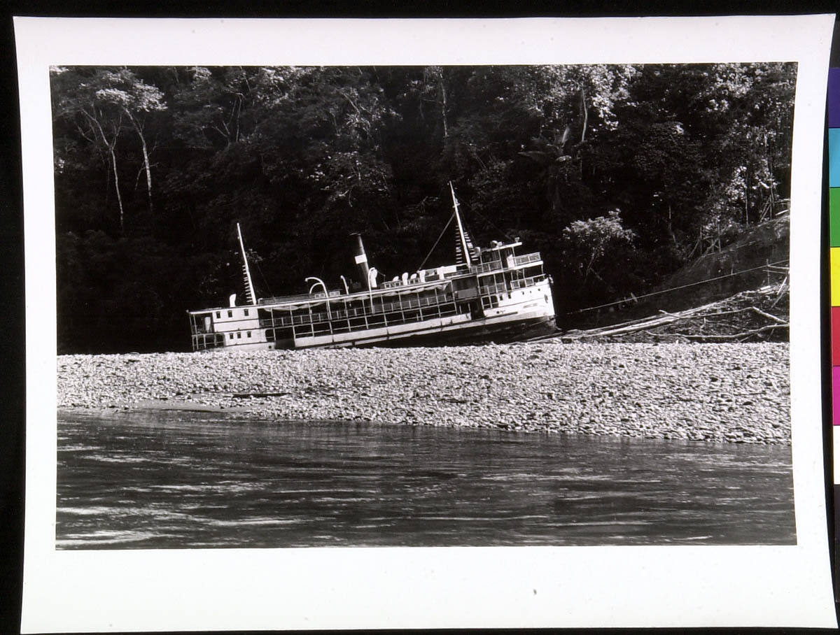 Boat Up Hill, Lake and Stones in Foreground