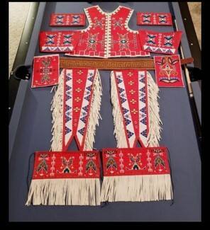 vest, arm bands, leggings, belt, image provided by artist - not for public use