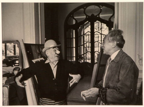 Picasso, Masked as an Italian Clown, Welcomes Jean Cocteau