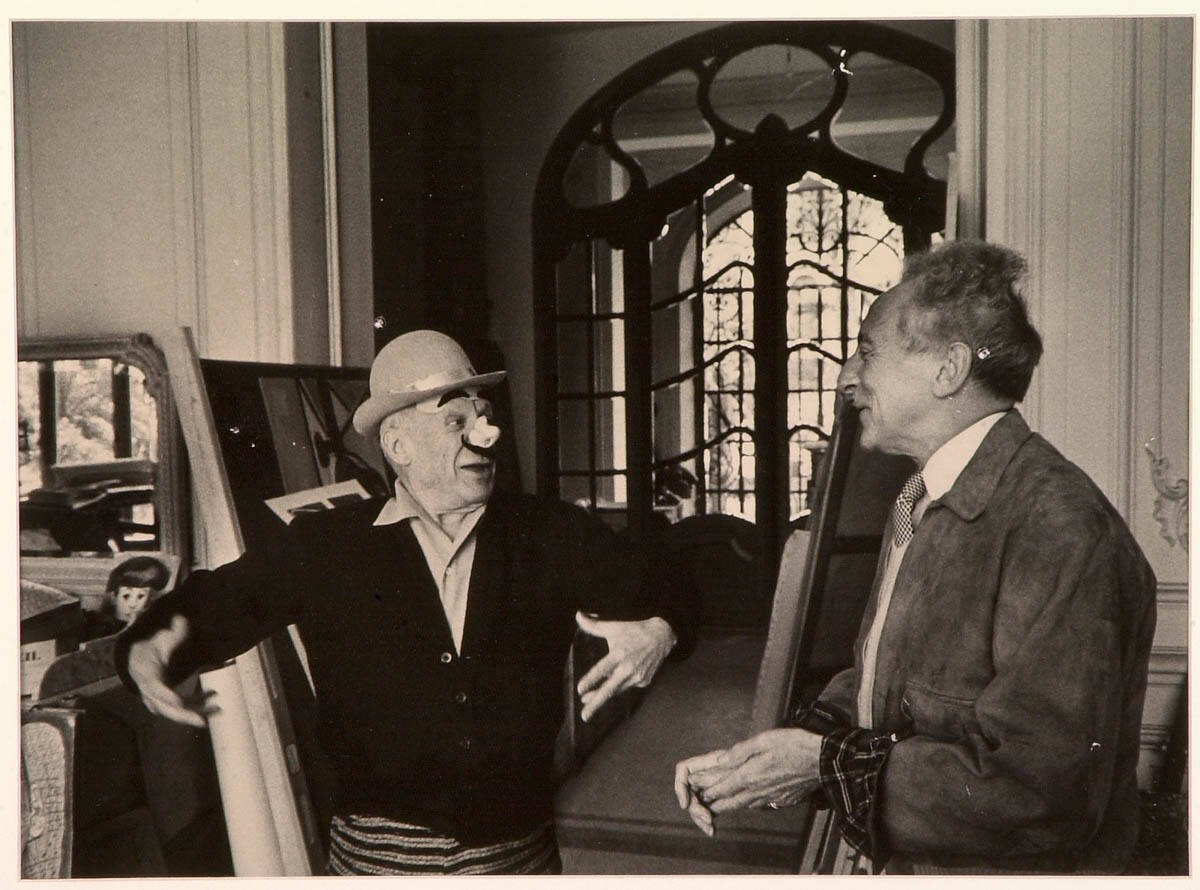 Picasso, Masked as an Italian Clown, Welcomes Jean Cocteau