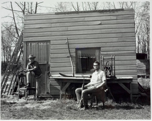 Two Men in Front of Shack