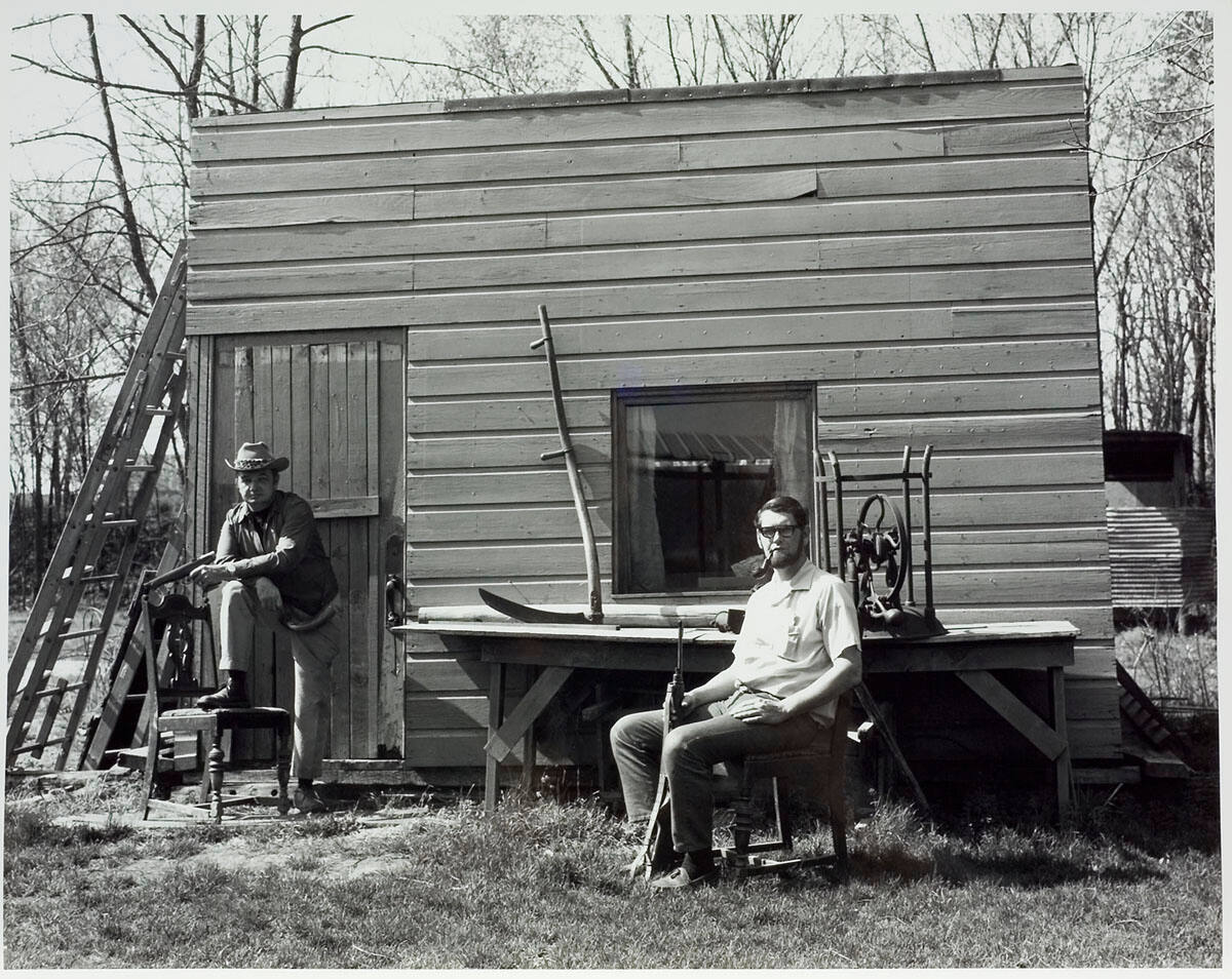 Two Men in Front of Shack