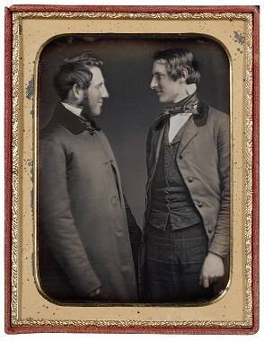 Two men holding hands
