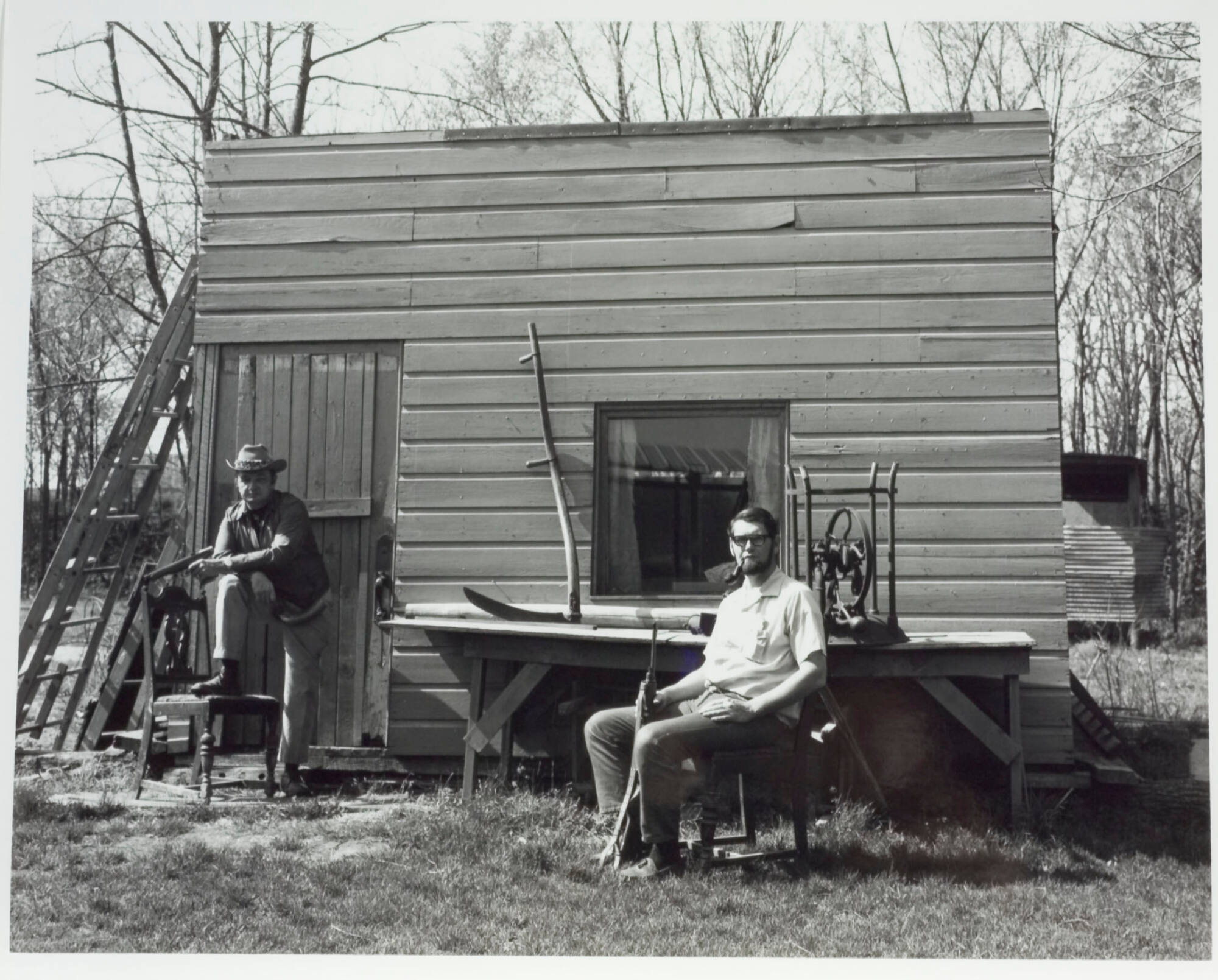Two Men in Front of Shack