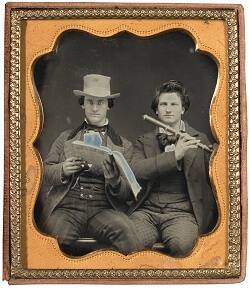 J. S. Boyd and Mr. Strandley with Flute and Sheet Music