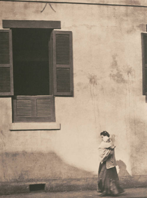 Woman Carrying Child