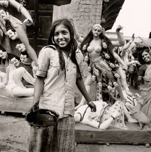 Girl with paint at Kali Puja, India