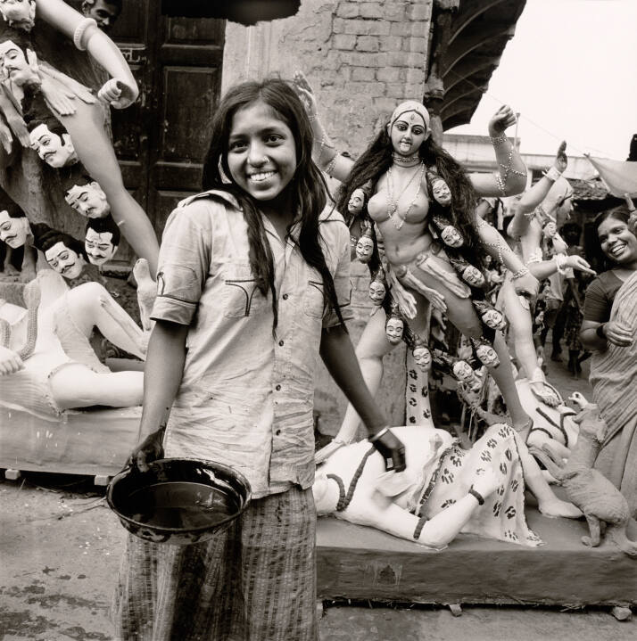 Girl with paint at Kali Puja, India