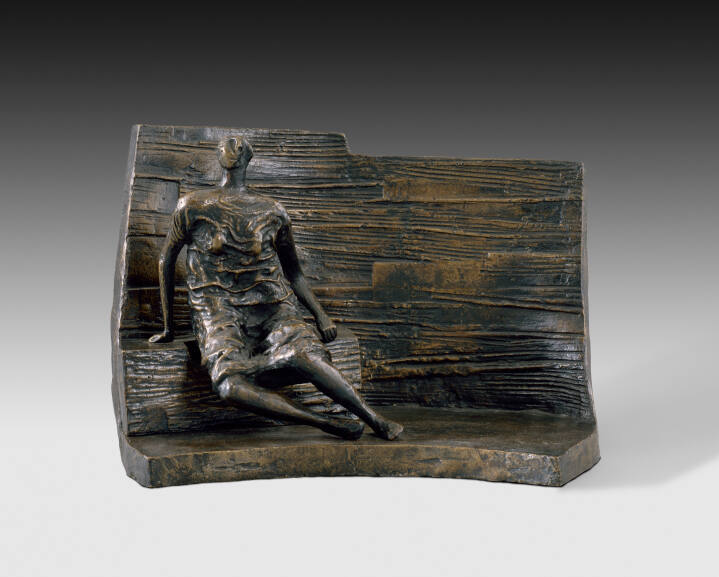 Draped Seated Figure Against Curved Wall