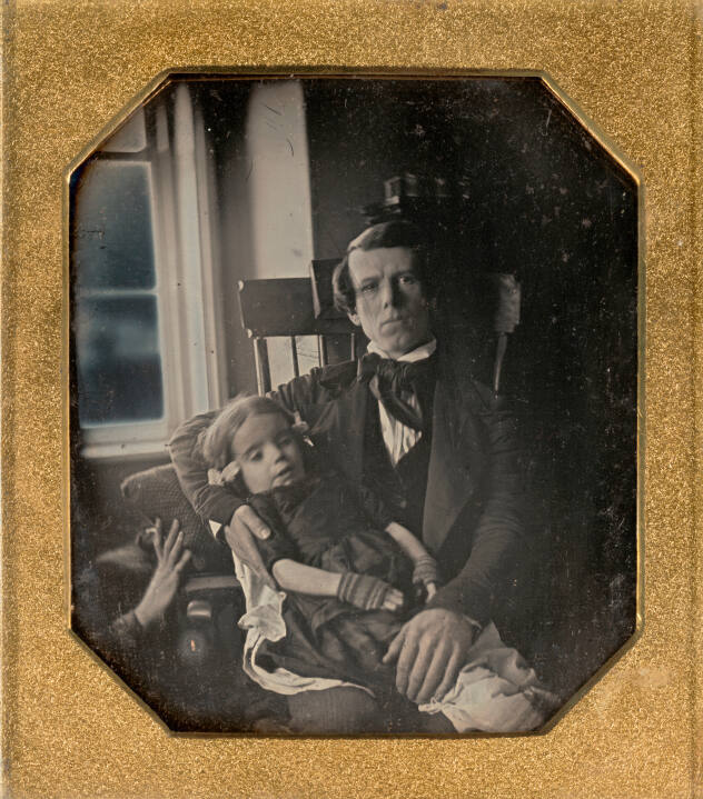 Man Holding Deceased Female Child