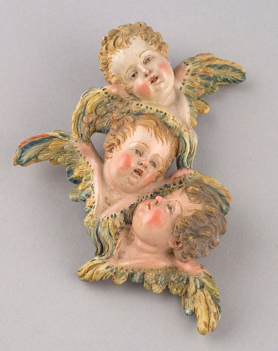 Three Putti Heads and Wings
