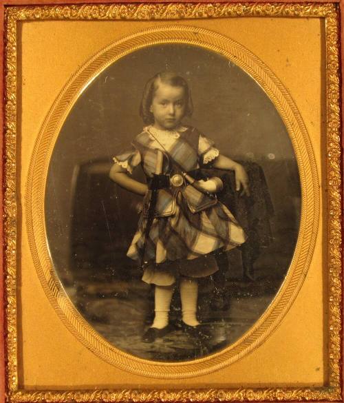 Standing Boy with Powder Horn and Toy Sword