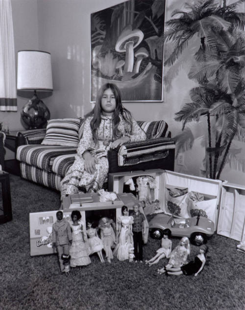 This is Valerie's world in miniature.  She makes it what she wants it to be...without war, racial hate or misunderstanding.  Ken and Barbie (dolls) are man and woman rather than Mom and Dad.  They enjoy living and having a camper truck is the good life.