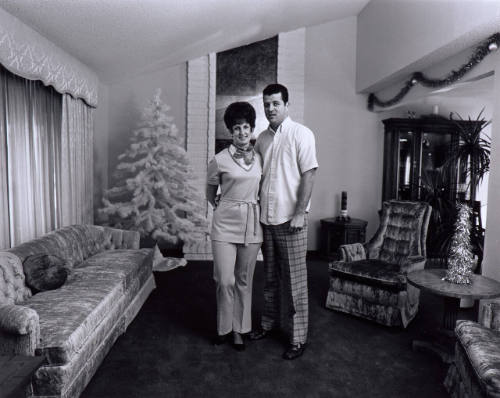 We lived in our house for a year without any living room furniture.  We wanted to furnish the room with things we loved, not early attic or leftovers.  Now we have everything but the pictures and the lamps.  (#2 of 2-part diptych)