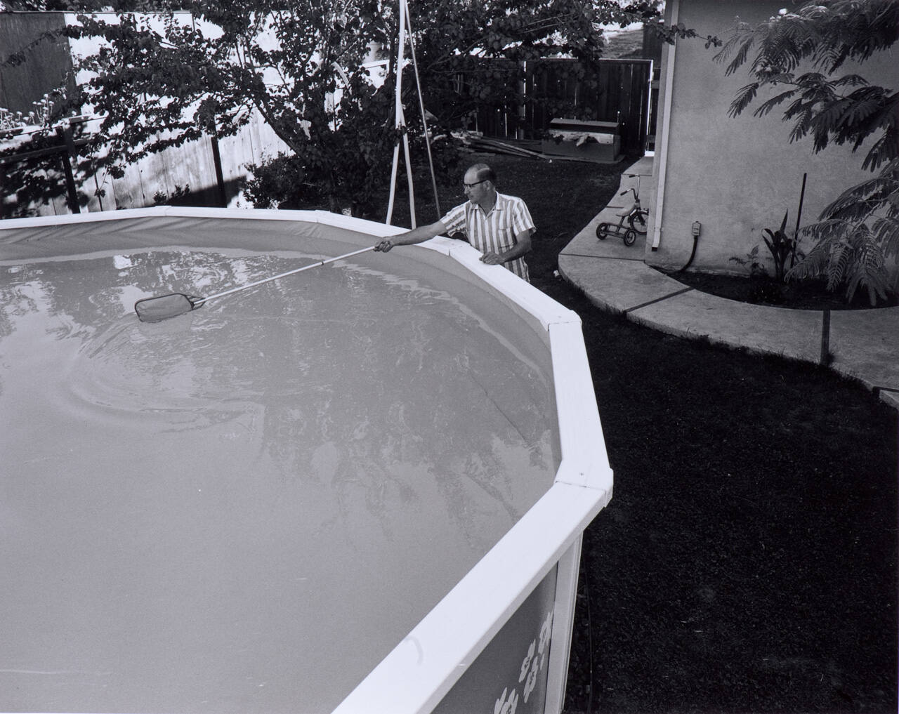 I bought the Doughboy pool for David and the kids and now no one wants to take the responsibility for cleaning it.