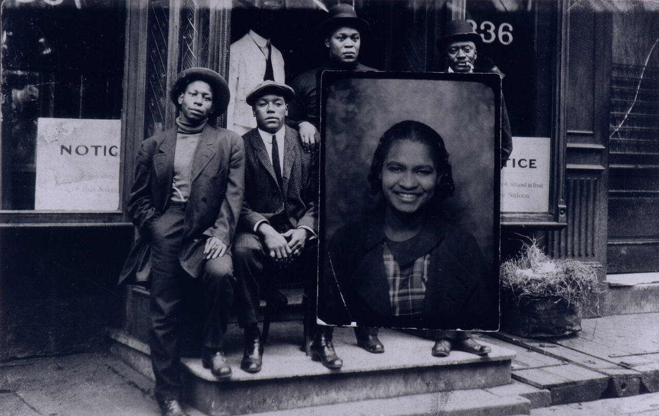 Untitled (Men on Steps with Woman's Portrait)