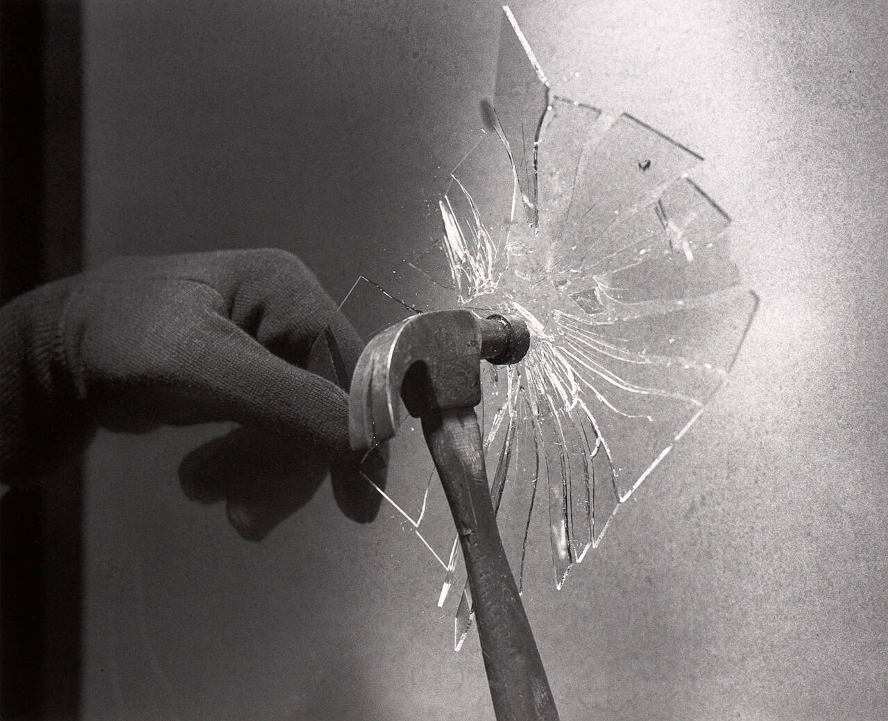 Hammer Breaks Glass Plate