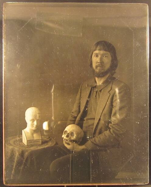 Portrait of Grant B. Romer with Skull and Phrenology Bust
