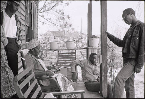 Charles Sherrod (standing) and Randy Battle (seated) visit a supporter in the countryside; Southwest Georgia