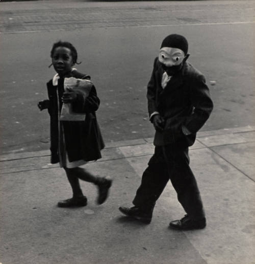 Untitled (boy with mask and girl on sidewalk)